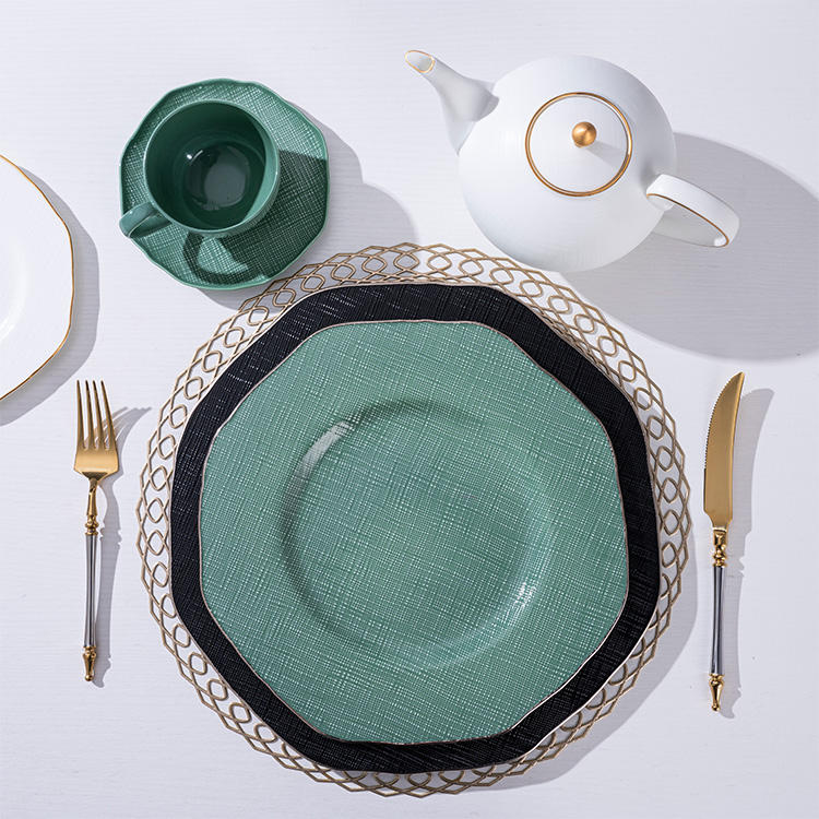 Luxury gold-rimmed bone china tableware set, including ceramic plates and salad bowls, suitable for upscale dining.