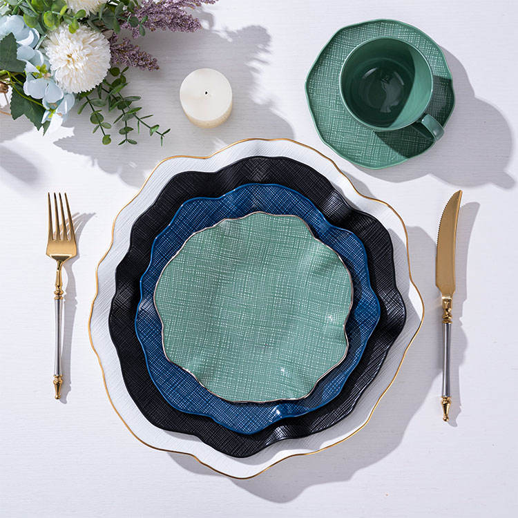 Luxury gold-rimmed bone china tableware set, including ceramic plates and salad bowls, suitable for upscale dining.