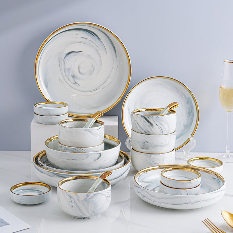 Marble-patterned ceramic tableware set with swirling patterns and gold trim. Luxurious tableware suitable for parties, weddings, and other ceramic/porcelain occasions.