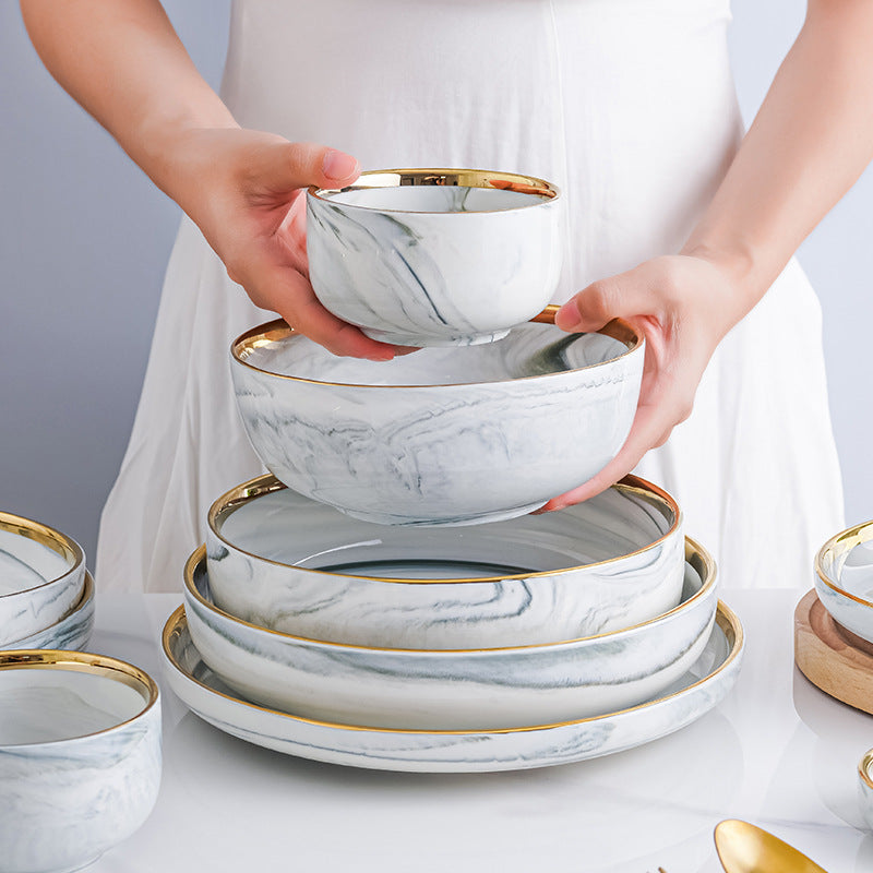 Marble-patterned ceramic tableware set with swirling patterns and gold trim. Luxurious tableware suitable for parties, weddings, and other ceramic/porcelain occasions.